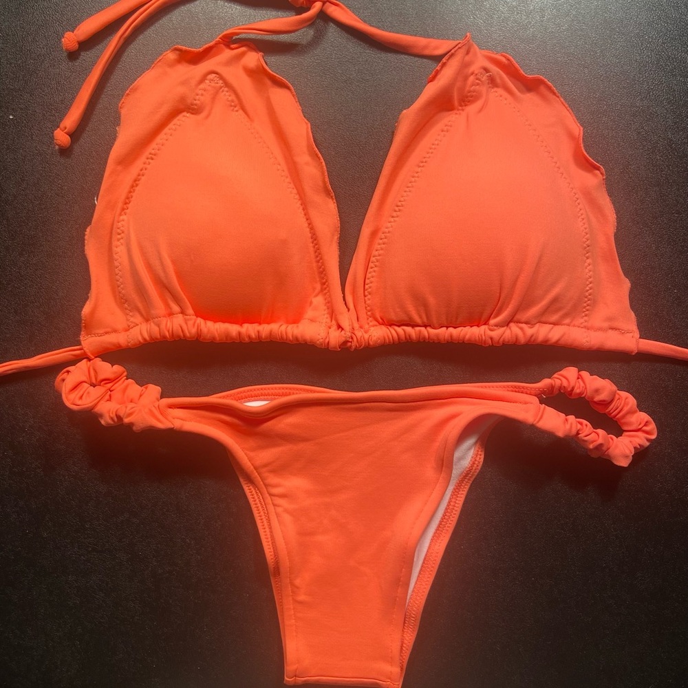 Coral bikini set with ruffle trim
